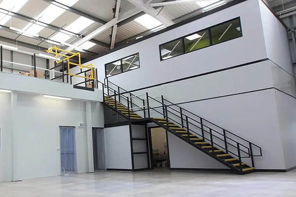 modern industrial building interior featuring staircase and yellow railing designed for 10 efficient uses of space