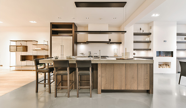 modern kitchen design with wooden island and bar stools featuring sleek appliances and minimalistic decor perfect for two chefs